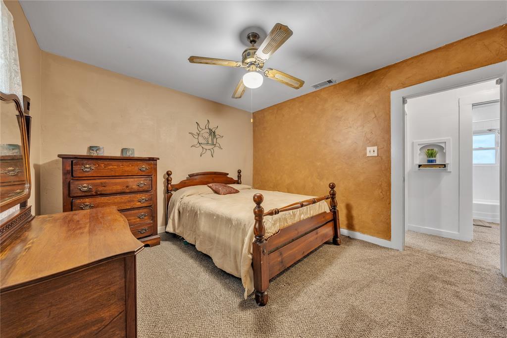 209 Dixie Road Millsap, TX 76066 - Photo 26 of 31 a bedroom with two beds and ceiling fan
