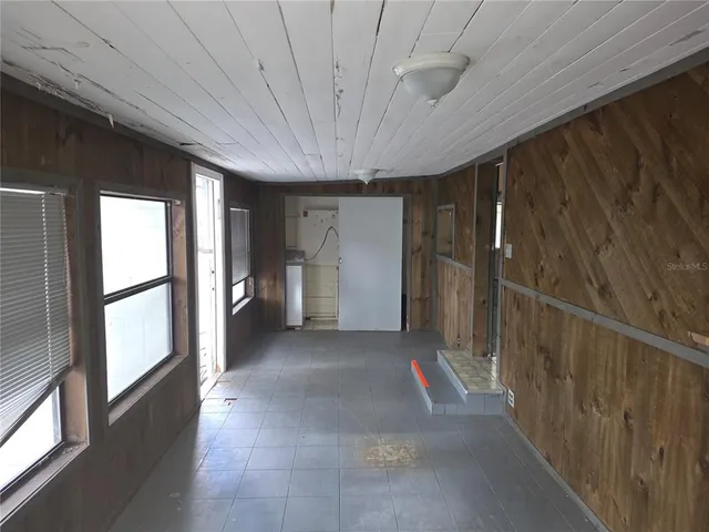 a kitchen with a refrigerator and a sink