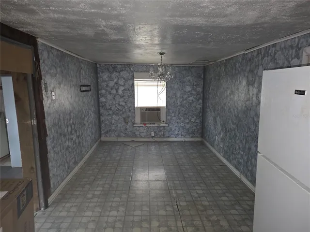 a bathroom with a granite countertop toilet a mirror and a sink