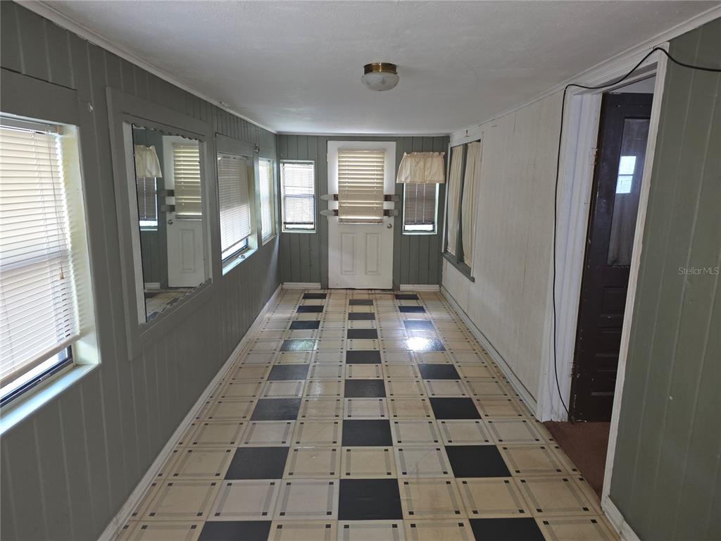 404 Northwest 7th Street Mulberry, FL 33860 - Photo 20 of 22 a hallway with black and white checkered floor