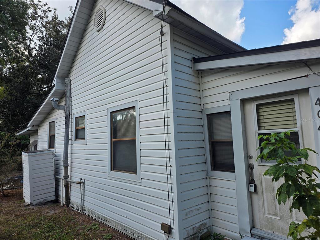 404 Northwest 7th Street Mulberry, FL 33860 - Photo 4 of 22 a view of a house with a yard and garage