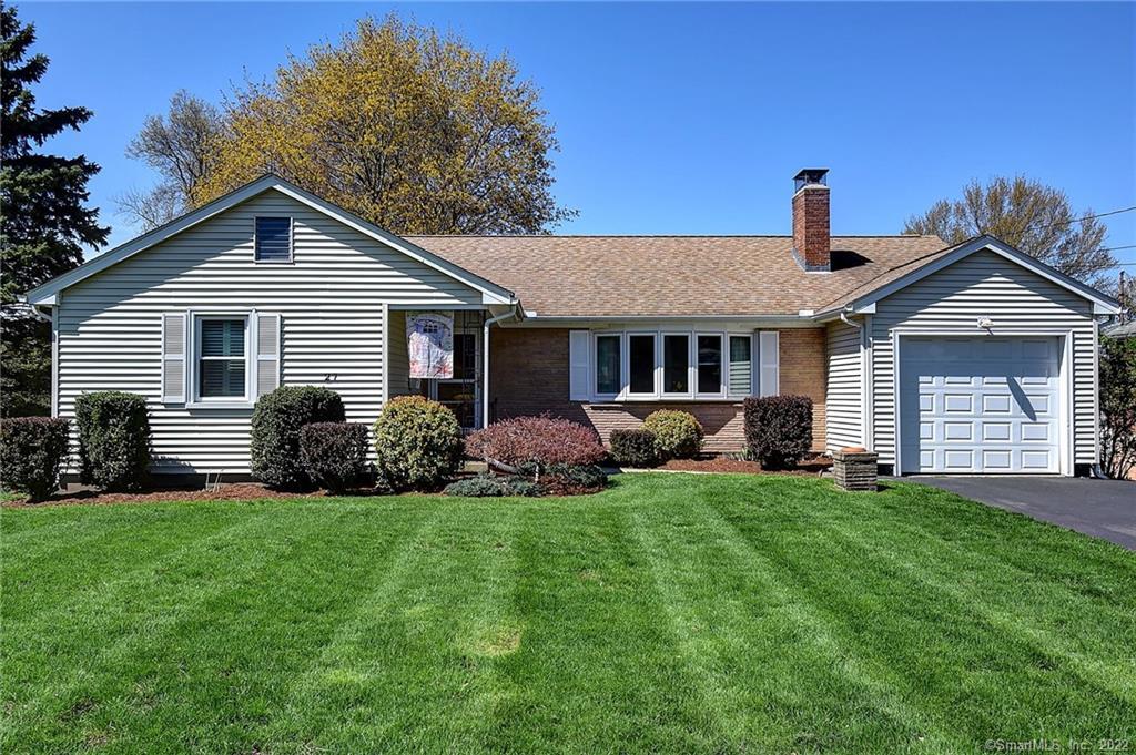 27 Sherburne Road Wethersfield, CT 06109 - Photo 1 of 1 a front view of a house with a yard and garage