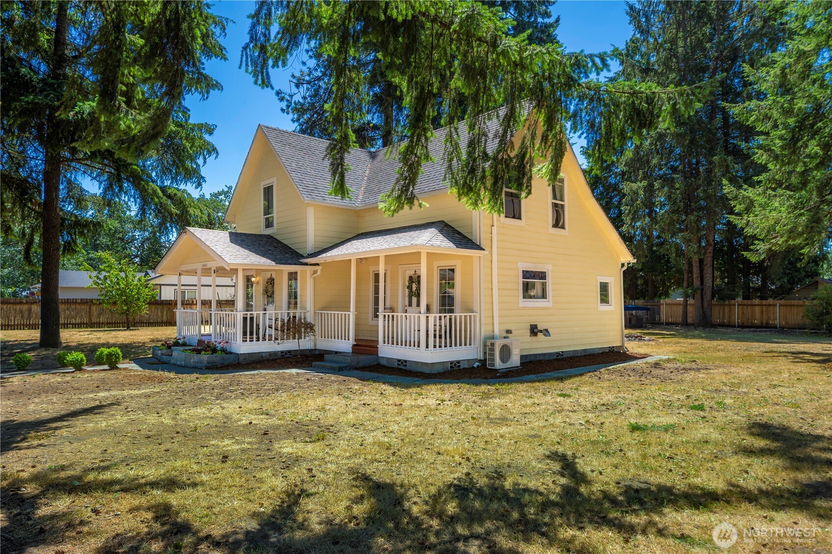 10443 184th Avenue Southwest Rochester, WA 98579 - Photo 29 of 38 a view of a white house with a yard and large tree