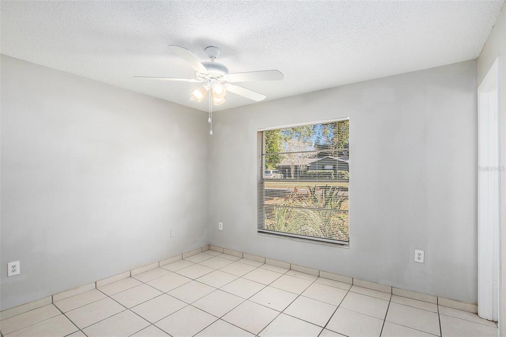 217 Faithway Drive Seffner, FL 33584 - Photo 17 of 29 an empty room with windows and fan