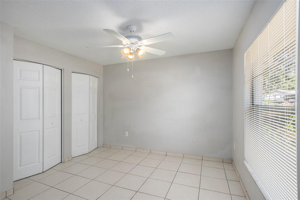 217 Faithway Drive Seffner, FL 33584 - Photo 18 of 29 wooden floor in an empty room with a window