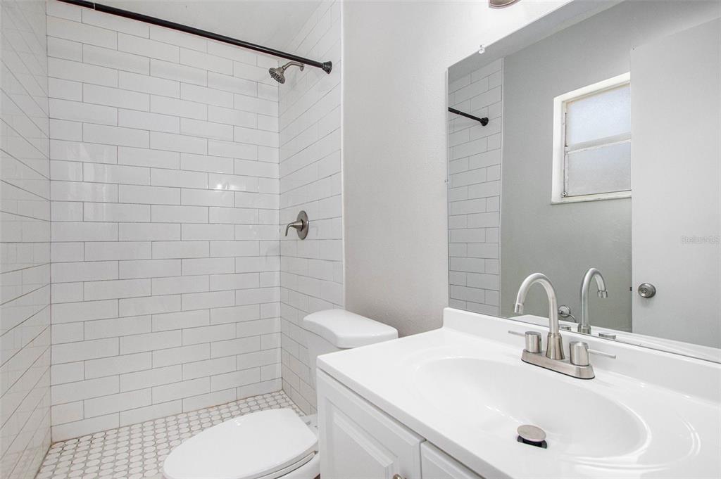 217 Faithway Drive Seffner, FL 33584 - Photo 22 of 29 a bathroom with a sink toilet and shower