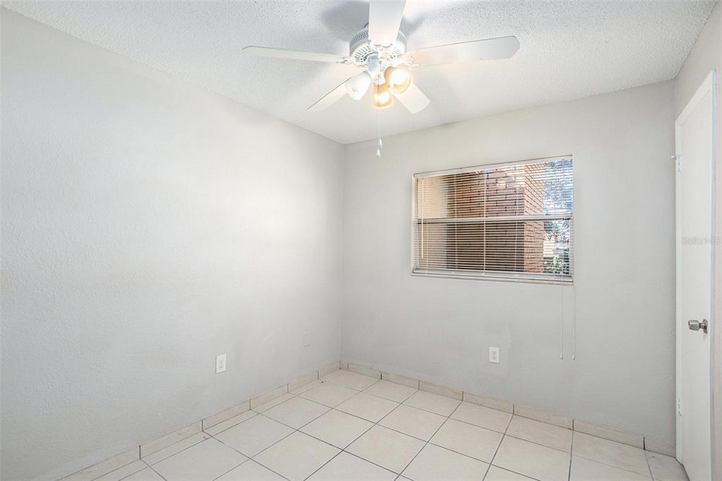 217 Faithway Drive Seffner, FL 33584 - Photo 24 of 29 an empty room with windows and fan