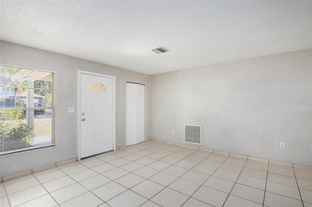 217 Faithway Drive Seffner, FL 33584 - Photo 7 of 29 a view of an empty room and window