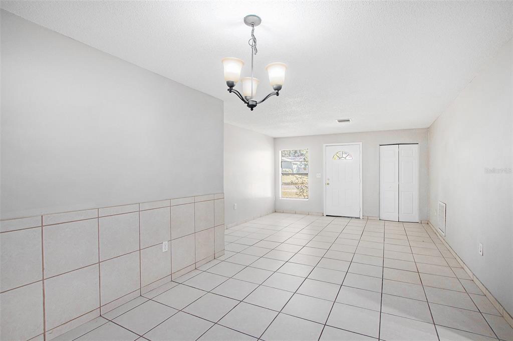 217 Faithway Drive Seffner, FL 33584 - Photo 9 of 29 a view of an empty room and chandelier fan