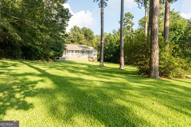 a view of a chairs and table in the patio