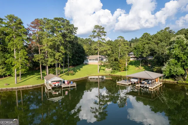 an aerial view of a houses with yard