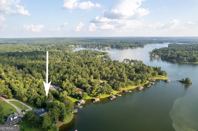 a dining room with furniture a chandelier and wooden floor