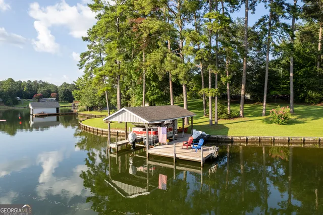 a view of a room with furniture and a large window