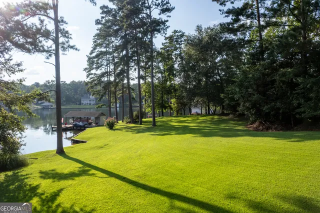 a bathroom with a granite countertop double vanity sink mirror and