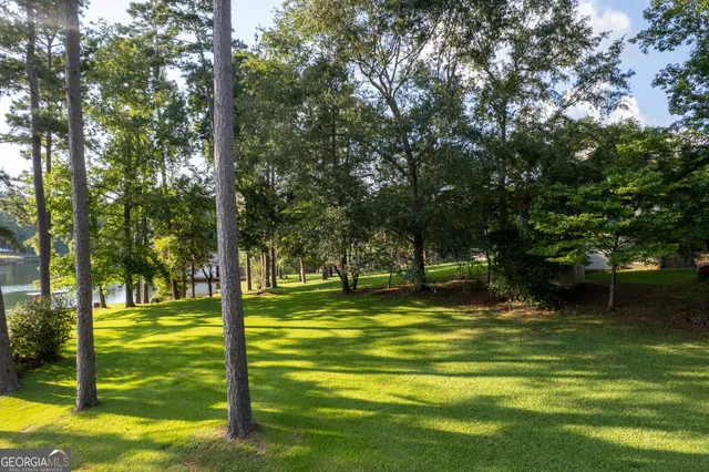 a kitchen with stainless steel appliances granite countertop a stove top oven a refrigerator a sink and a stove