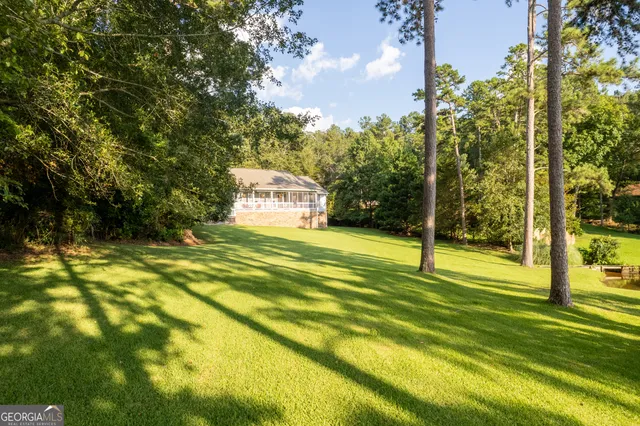 a kitchen with granite countertop stainless steel appliances and white cabinets
