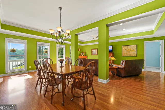 a spacious bathroom with a toilet sink and mirror