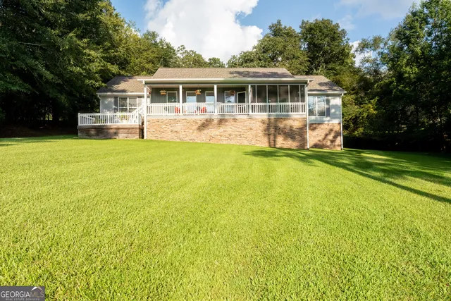 a view of a lake with houses in the back
