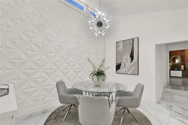 a living room with furniture and white walls