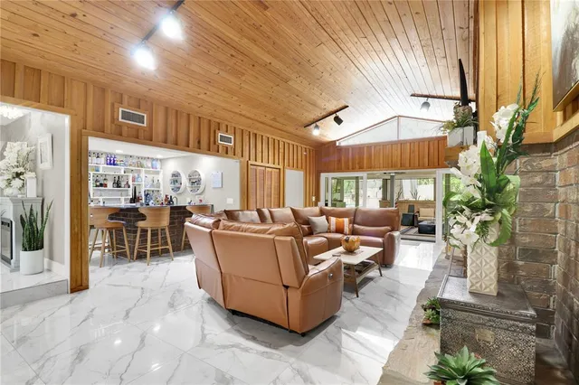 a bedroom with a large bed and a couch