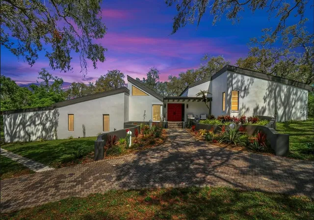 a view of a livingroom with furniture and a window