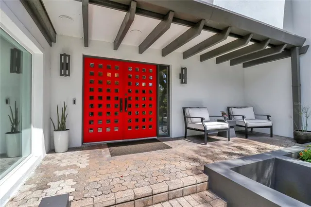 a kitchen with stainless steel appliances kitchen island granite countertop a refrigerator and a sink
