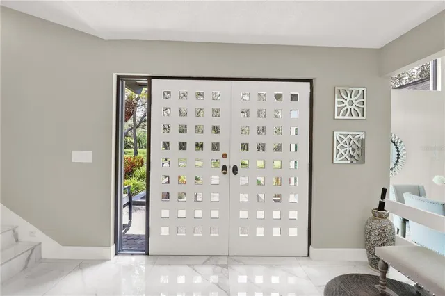 a large kitchen with stainless steel appliances kitchen island granite countertop a sink and cabinets