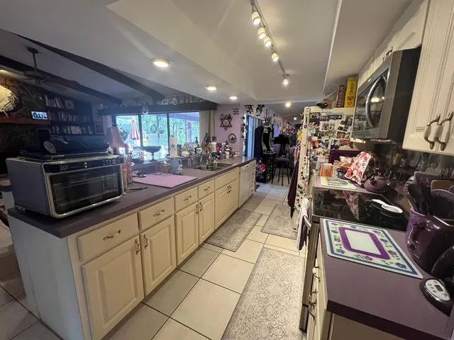 a lobby with furniture and a potted plant