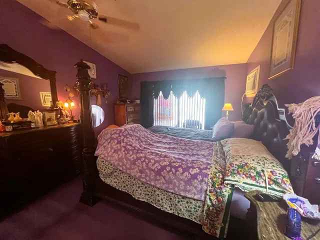 a view of gym equipment and racks