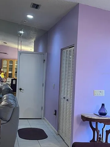 a bathroom with a double vanity sink mirror and tub