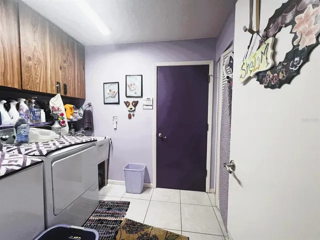 a room with gym equipment and a large window