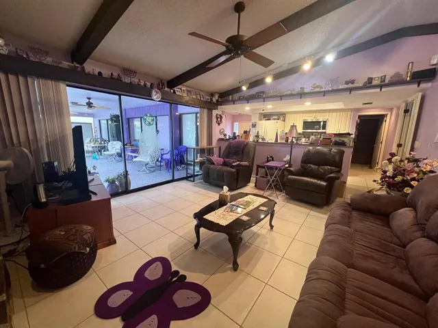 a dining room with furniture and a chandelier