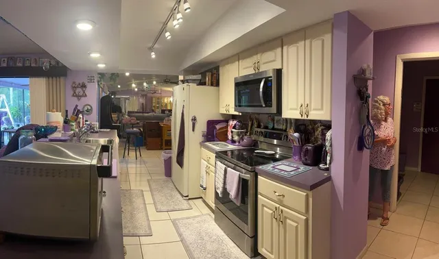 a view of a patio with a table and chairs