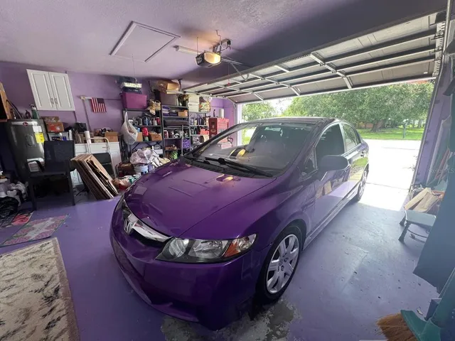 a view of a chairs and table in patio with a barbeque