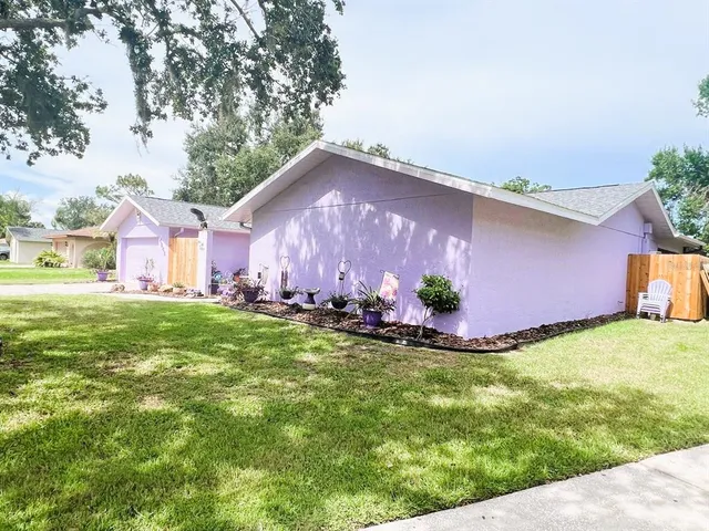 a backyard of a house with lots of green space