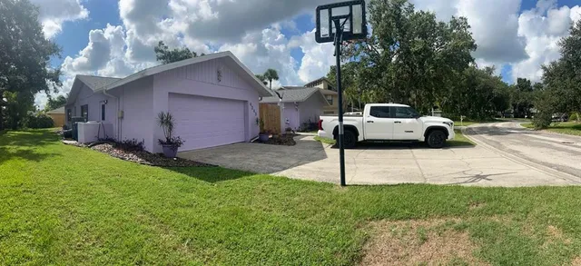 a view of a patio with table and chairs potted plants