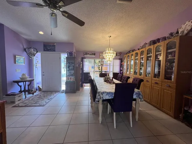 a view of a hallway with wooden shelves