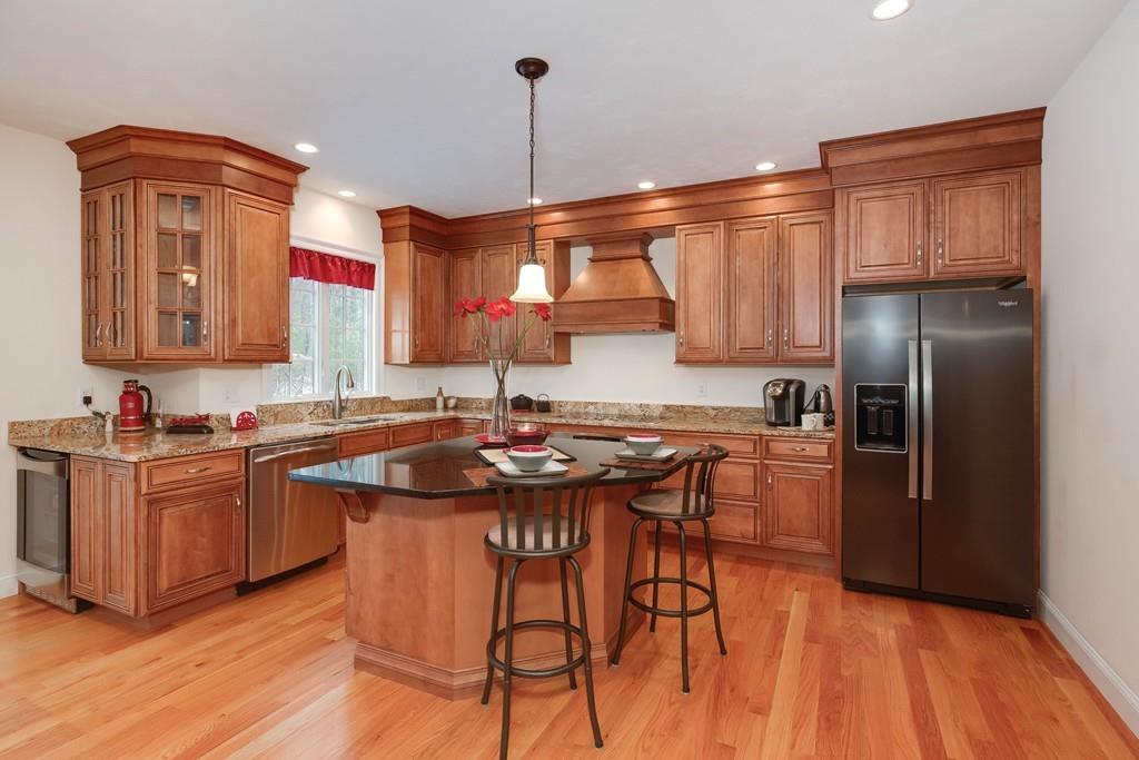 154 Brooks Station Road Princeton, MA 01541 - Photo 11 of 40 a kitchen with stainless steel appliances granite countertop a sink a stove and a refrigerator