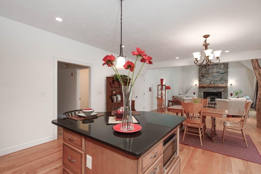 154 Brooks Station Road Princeton, MA 01541 - Photo 12 of 40 a view of a dining room with furniture and chandelier