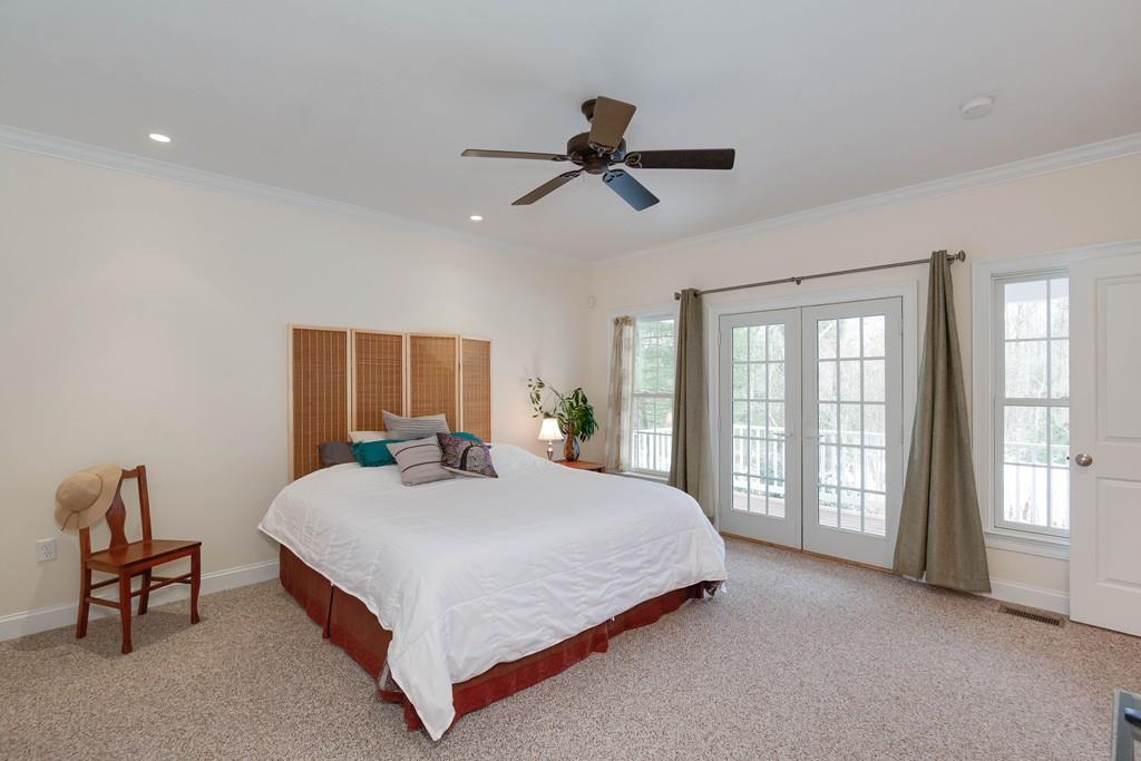154 Brooks Station Road Princeton, MA 01541 - Photo 16 of 40 a bedroom with a large bed and a large window
