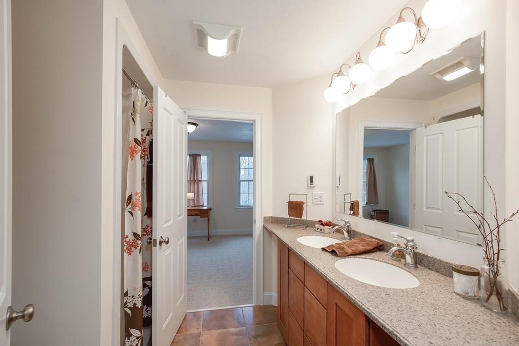 154 Brooks Station Road Princeton, MA 01541 - Photo 30 of 40 a bathroom with a sink vanity and a mirror