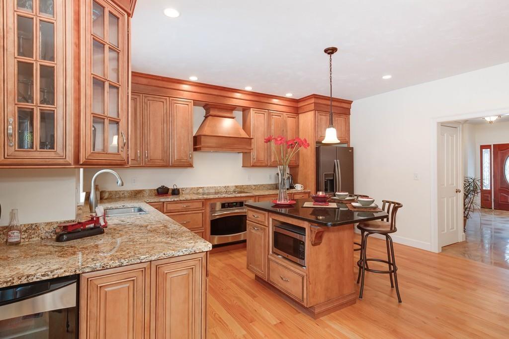 154 Brooks Station Road Princeton, MA 01541 - Photo 8 of 40 a kitchen with stainless steel appliances granite countertop a stove and a sink