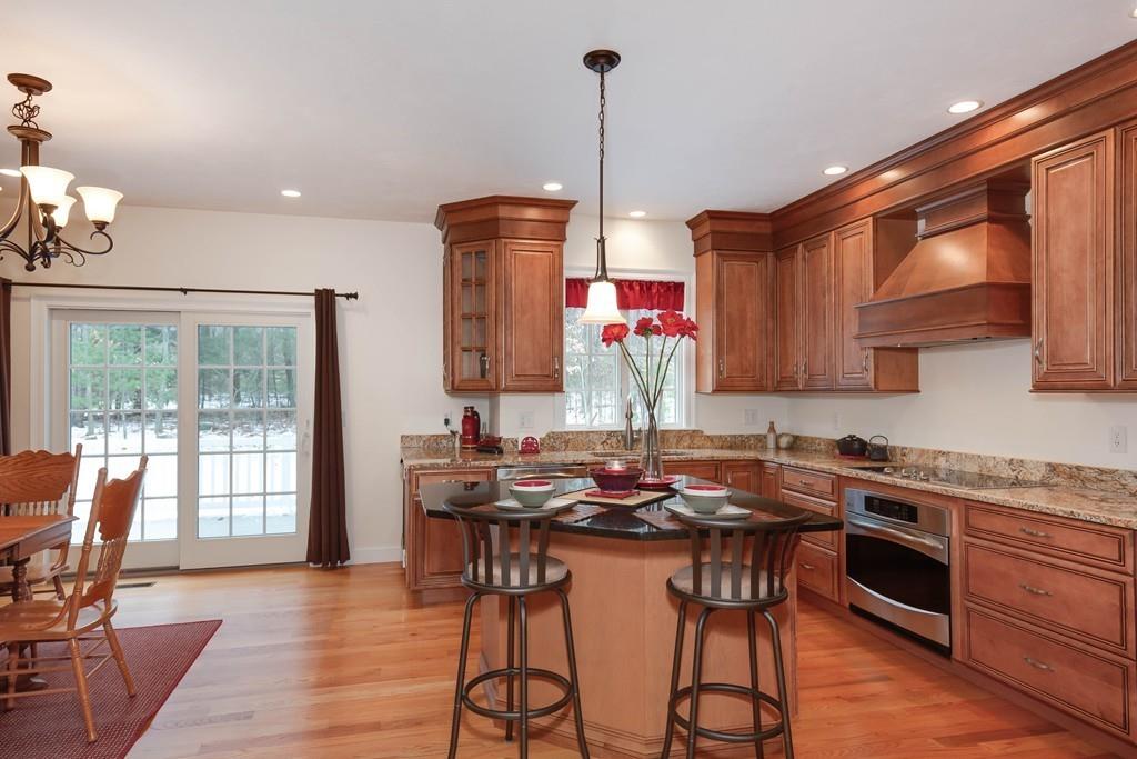 154 Brooks Station Road Princeton, MA 01541 - Photo 9 of 40 a kitchen with stainless steel appliances granite countertop a stove a sink dishwasher and a wooden cabinets