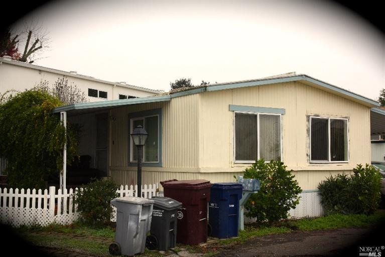 541 Mason Street, Unit 8 Healdsburg, CA 95448 - Photo 1 of 1 a front view of house with yard outdoor seating and barbeque oven