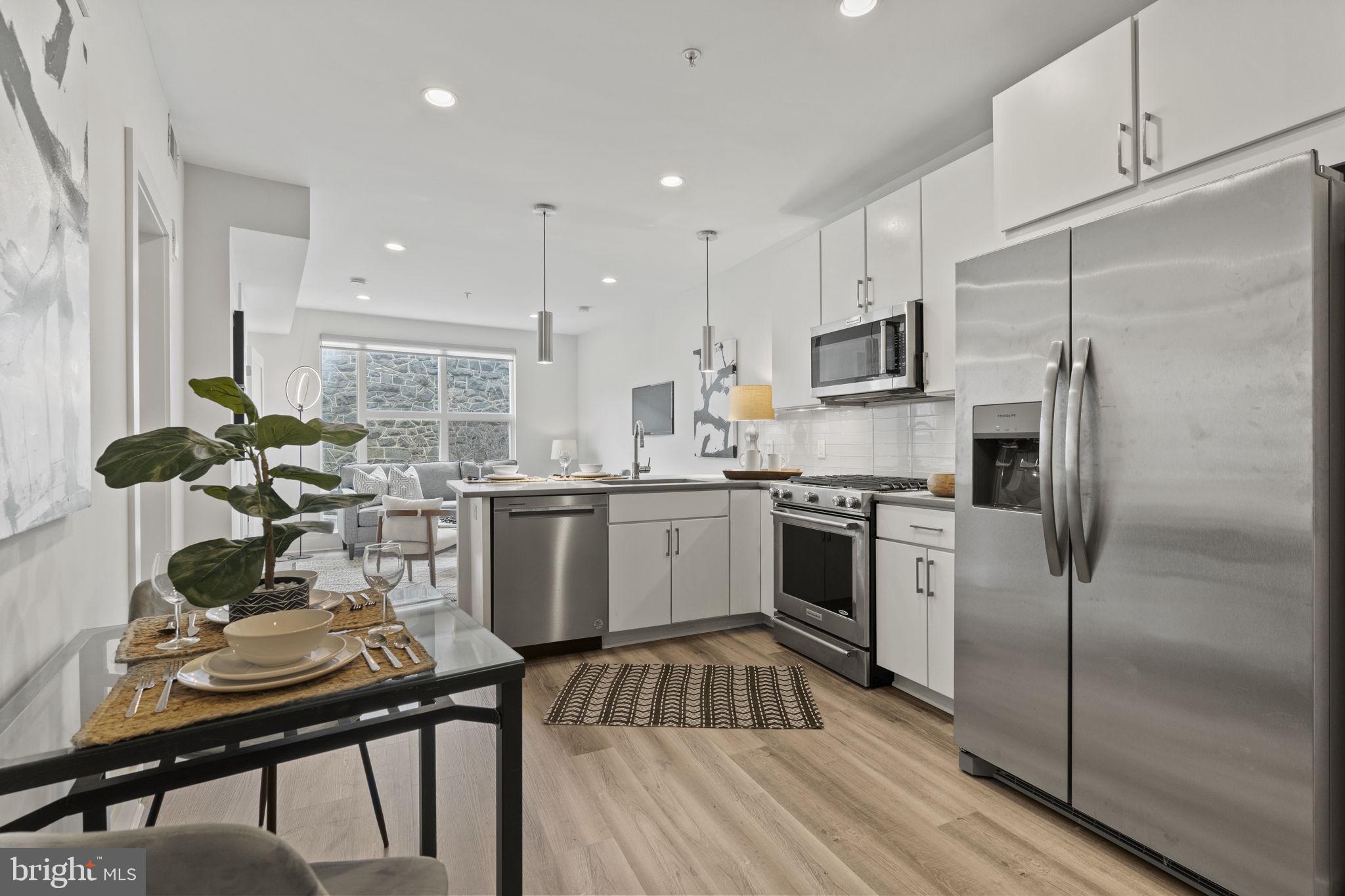 2337 Champlain Street Northwest, Unit 105 Washington, DC 20009 - Photo 12 of 26 Open kitchen allows space for a table and chairs