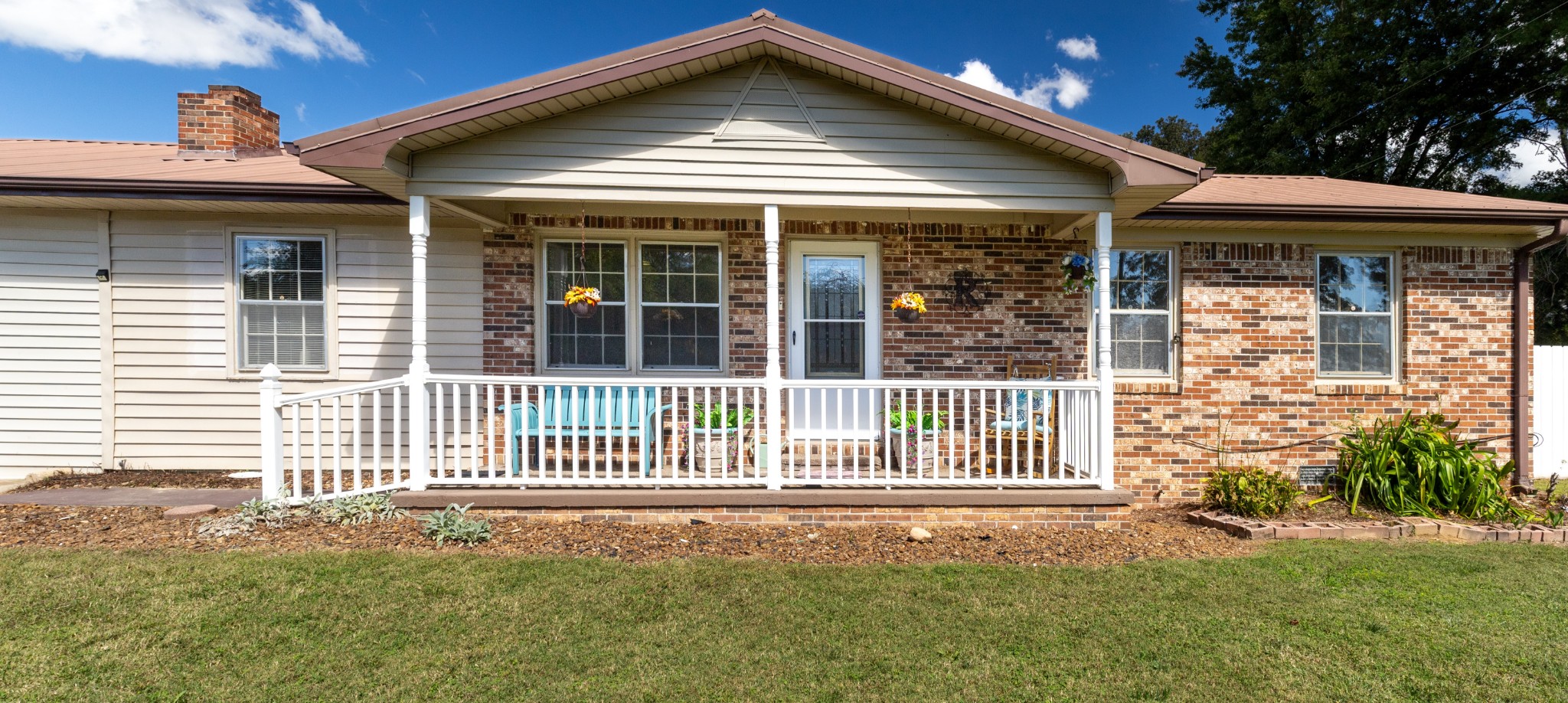 406 Asia Road Winchester, TN 37398 - Photo 11 of 30 a front view of a house with a garden and plants