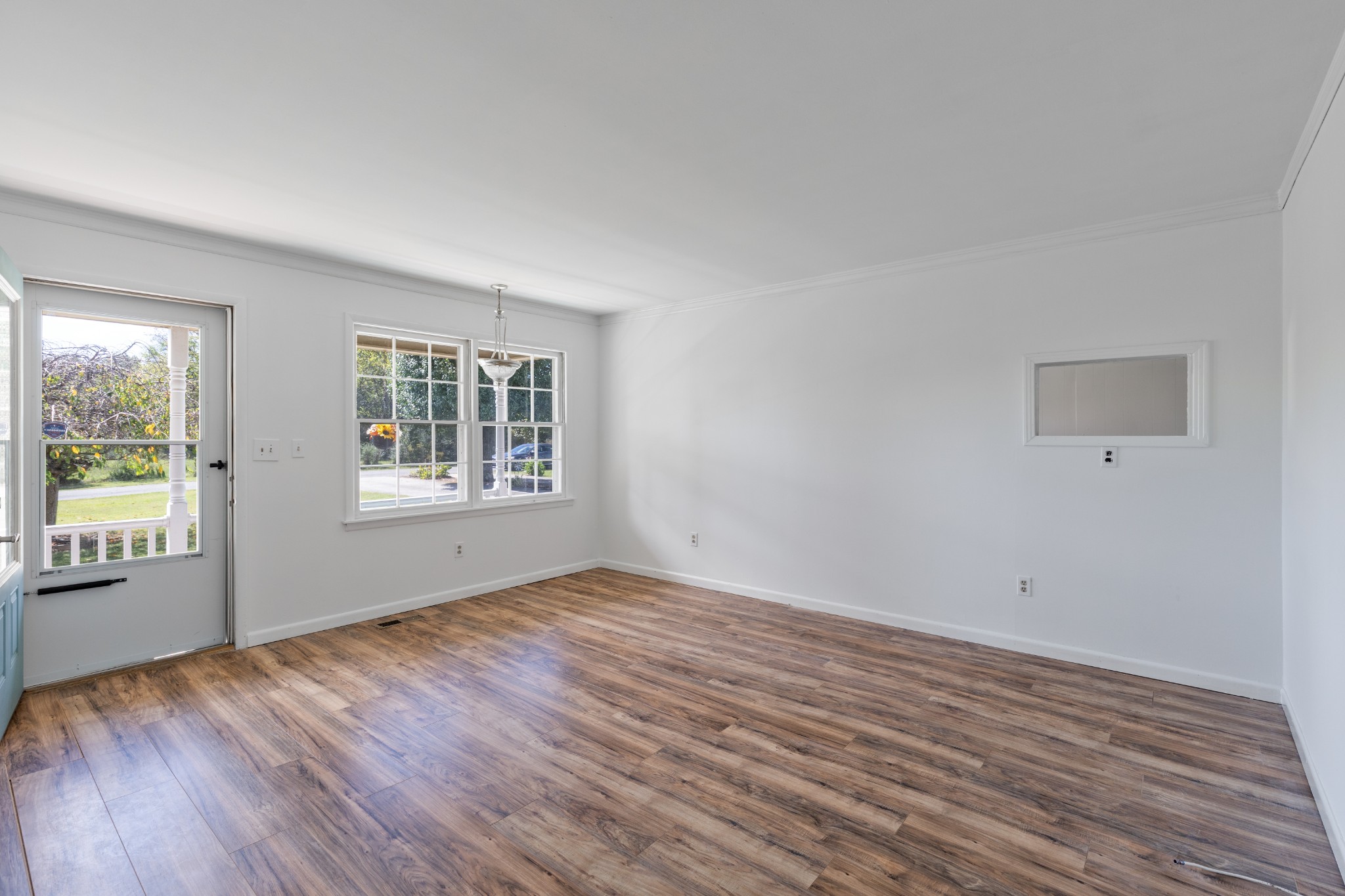 406 Asia Road Winchester, TN 37398 - Photo 14 of 30 a view of an empty room with wooden floor and a window