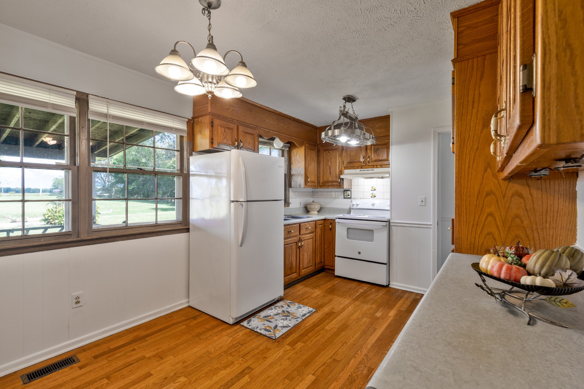 406 Asia Road Winchester, TN 37398 - Photo 15 of 30 a kitchen with stainless steel appliances granite countertop a refrigerator a sink dishwasher a stove and white countertops with wooden floor
