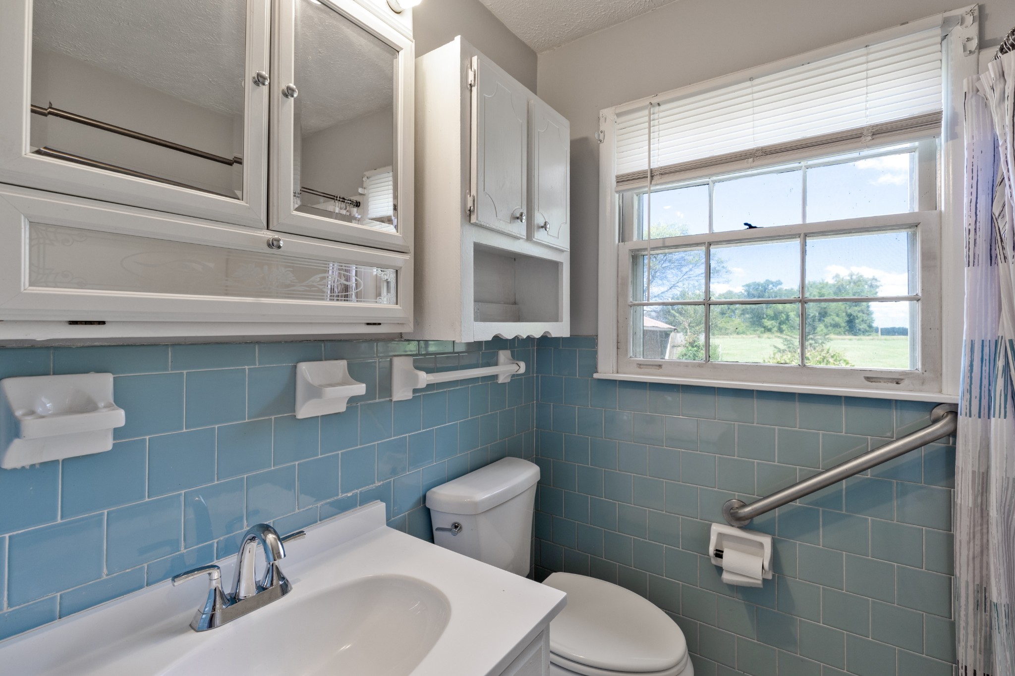 406 Asia Road Winchester, TN 37398 - Photo 19 of 30 a bathroom with a sink and a toilet
