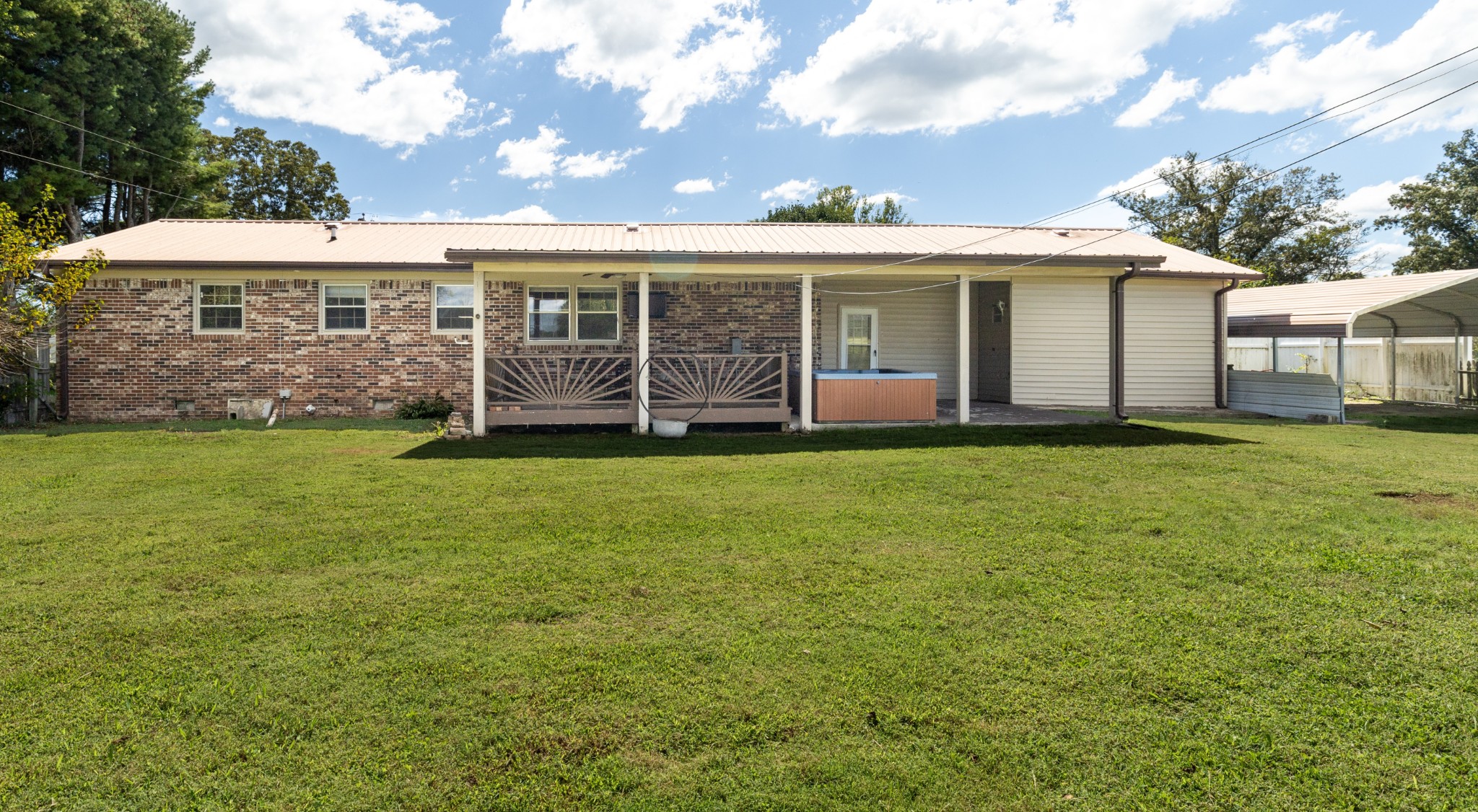 406 Asia Road Winchester, TN 37398 - Photo 5 of 30 a front view of a house with a garden and trees